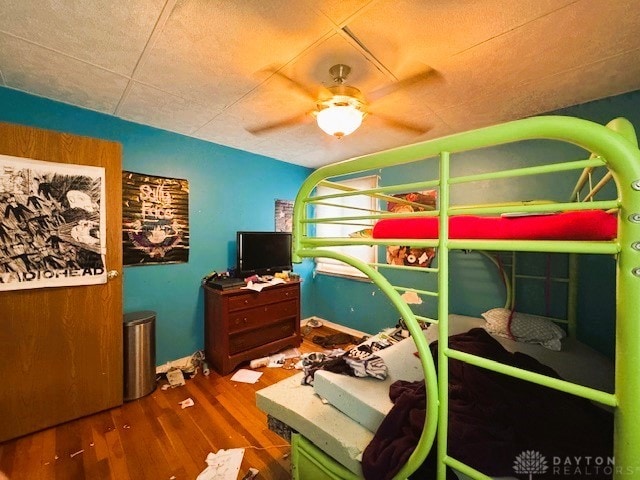 bedroom featuring ceiling fan and hardwood / wood-style flooring