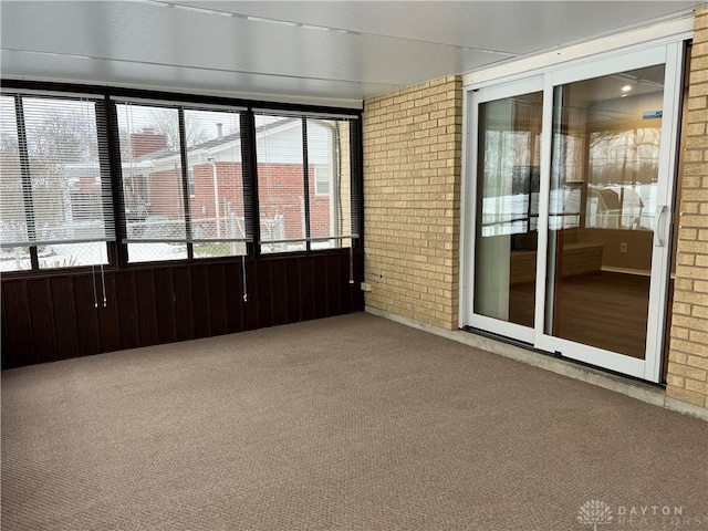 unfurnished sunroom featuring a wealth of natural light