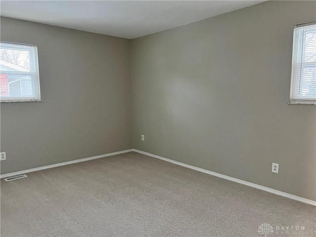 empty room featuring carpet flooring