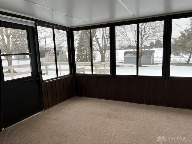 unfurnished sunroom with plenty of natural light