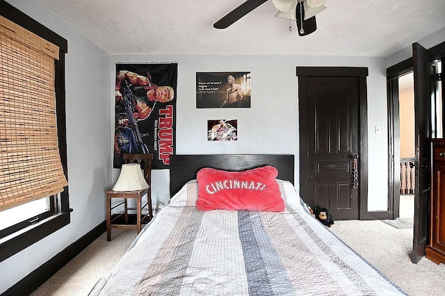 bedroom featuring carpet, ceiling fan, and baseboards