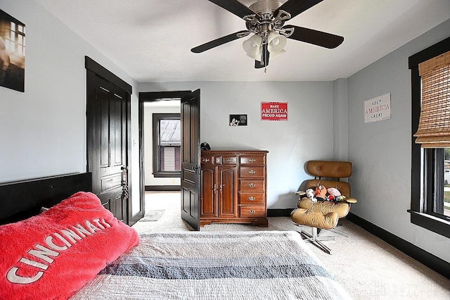 bedroom with carpet flooring, ceiling fan, and baseboards