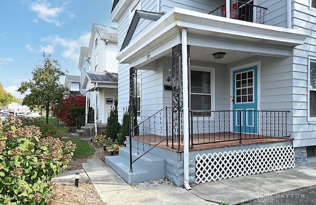 doorway to property featuring covered porch