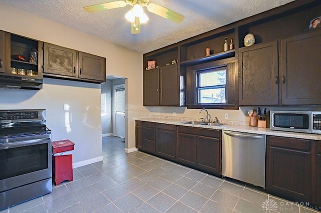 kitchen featuring appliances with stainless steel finishes, extractor fan, a sink, and open shelves