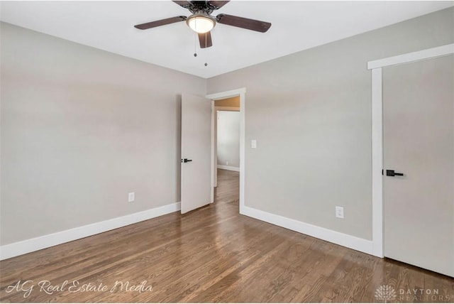 spare room with ceiling fan and wood-type flooring