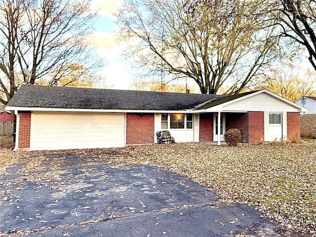 single story home featuring a garage