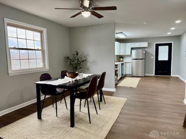 dining area featuring ceiling fan and light hardwood / wood-style flooring