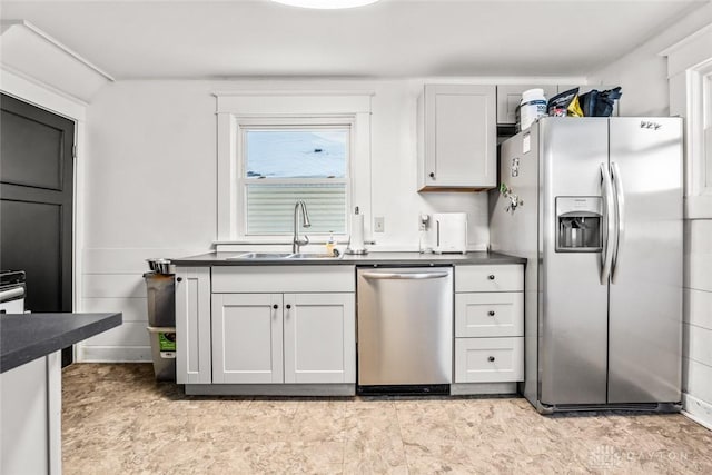 kitchen with white cabinets, sink, and stainless steel appliances