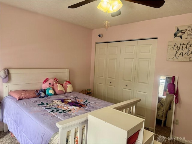 bedroom with ceiling fan, a closet, and carpet