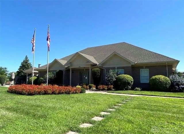 ranch-style house with a front lawn