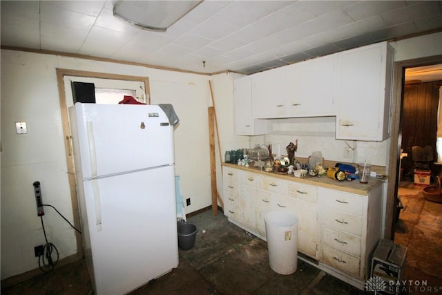 kitchen with white cabinets and white refrigerator