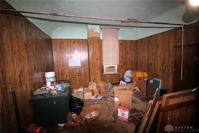 interior space featuring cooling unit and wood walls