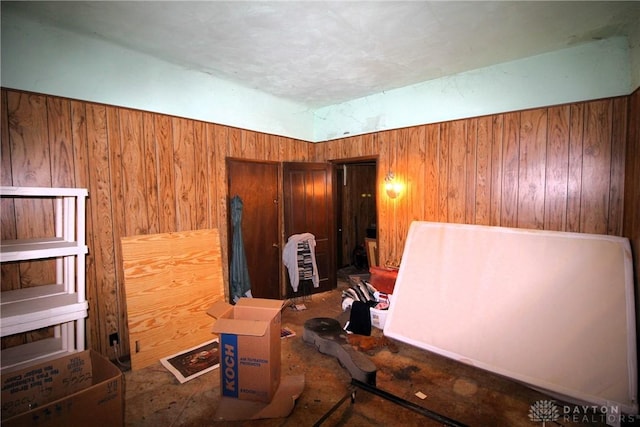 miscellaneous room featuring wooden walls