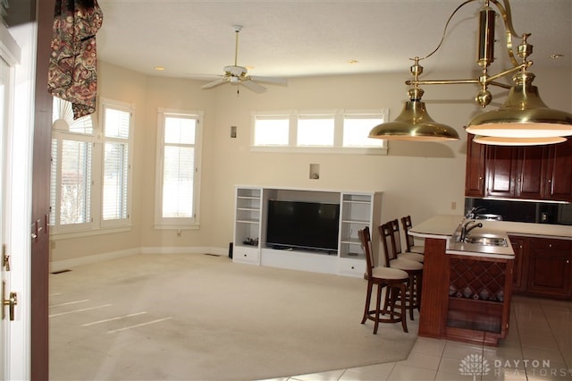 interior space with sink and ceiling fan