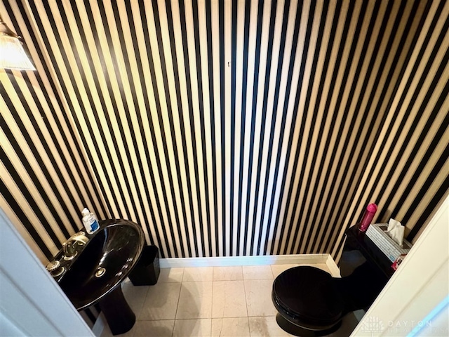 bathroom featuring tile patterned floors and toilet