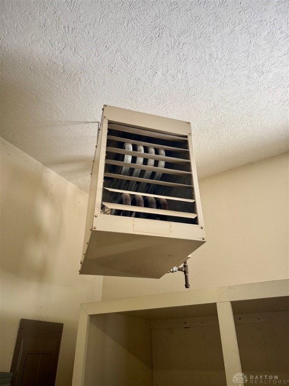 interior details with a textured ceiling