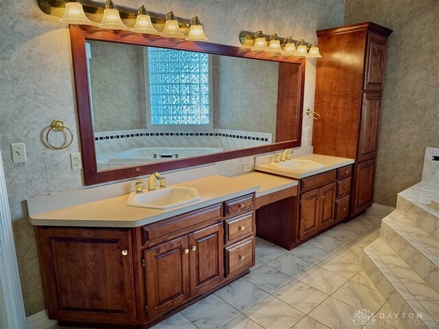 bathroom featuring vanity and a tub to relax in