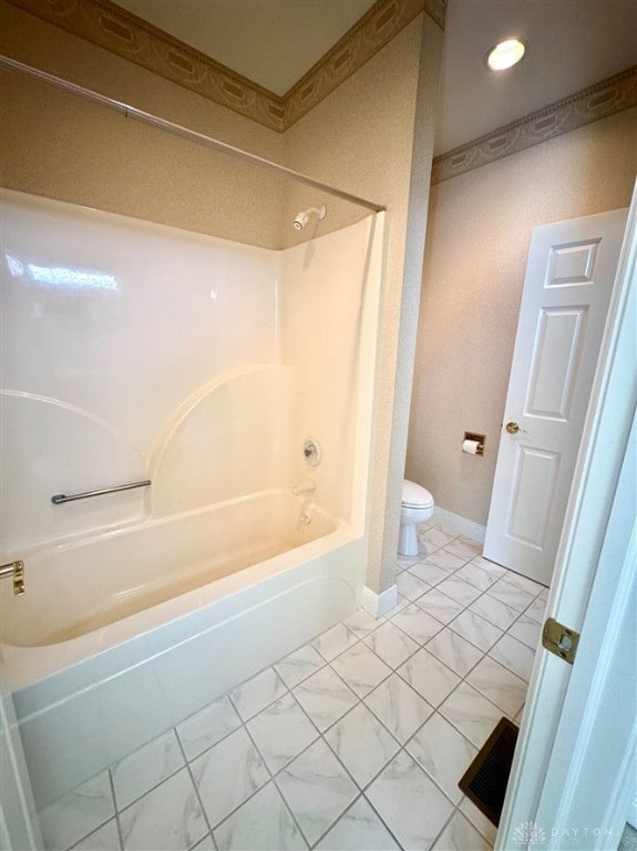 bathroom with shower / bathtub combination and toilet