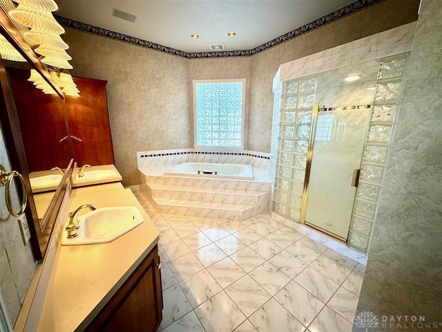 bathroom with plus walk in shower and vanity