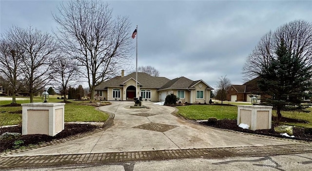 ranch-style house featuring a front lawn