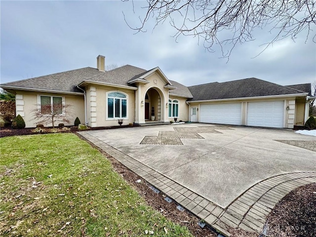 single story home with a garage and a front yard