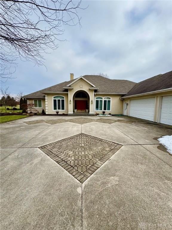 ranch-style home with a garage