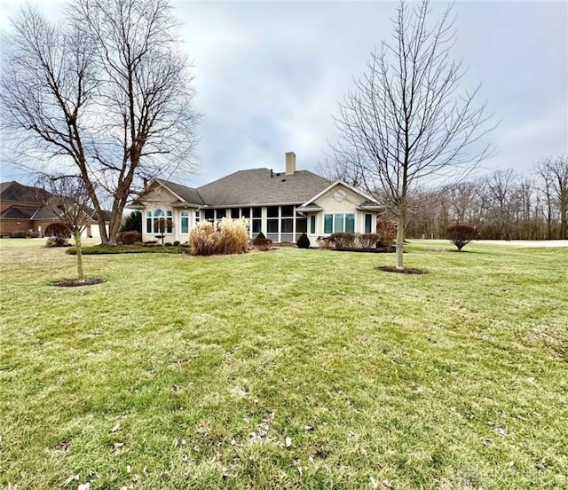 view of front of home with a front lawn