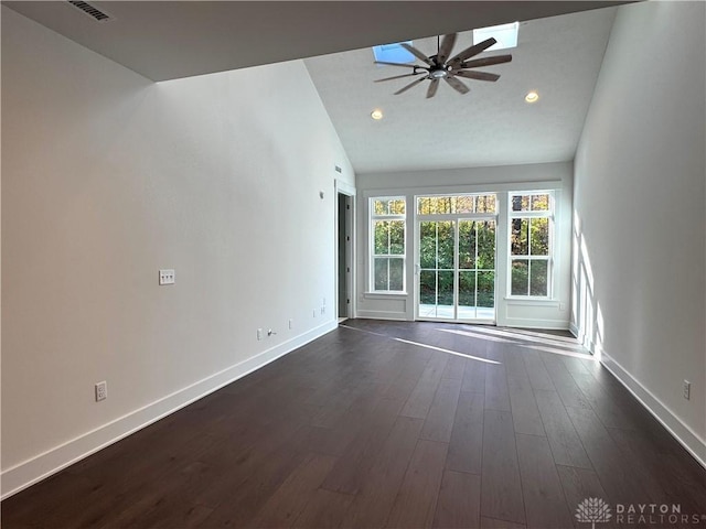 interior space with ceiling fan, lofted ceiling, and dark hardwood / wood-style floors