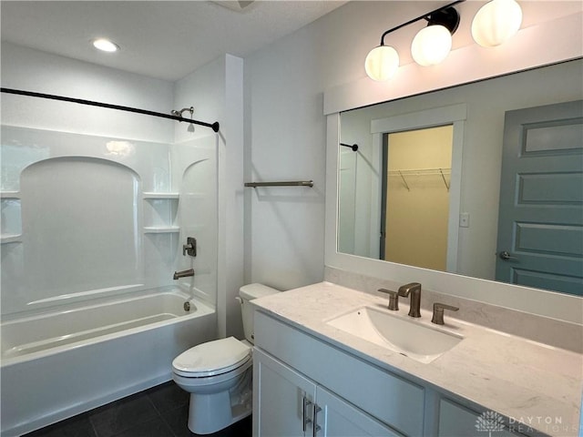 full bathroom featuring toilet, tile patterned floors, vanity, and bathtub / shower combination