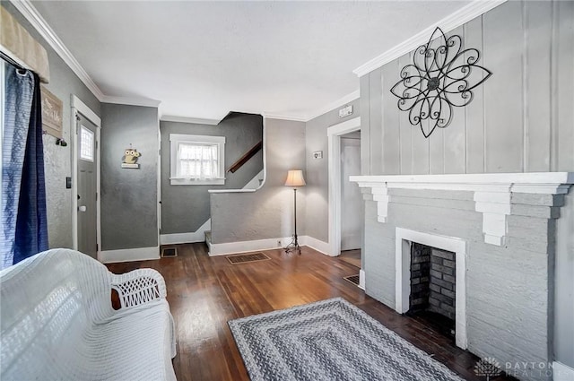 living room with dark hardwood / wood-style floors and ornamental molding