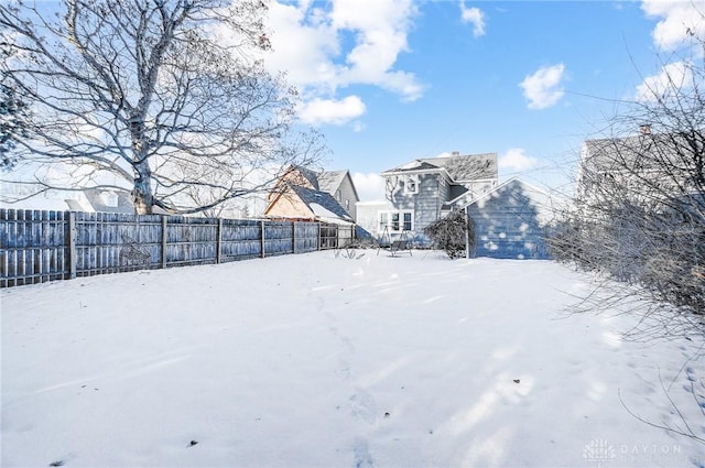 view of yard covered in snow