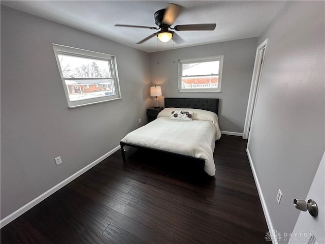 bedroom featuring ceiling fan and dark hardwood / wood-style floors