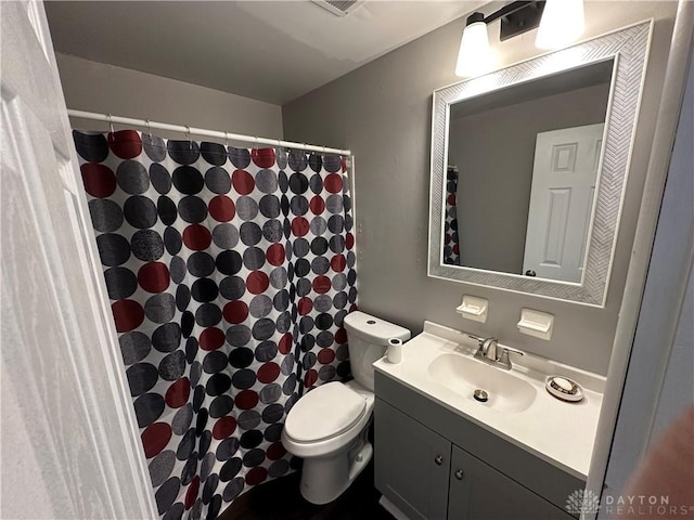 bathroom with toilet and vanity