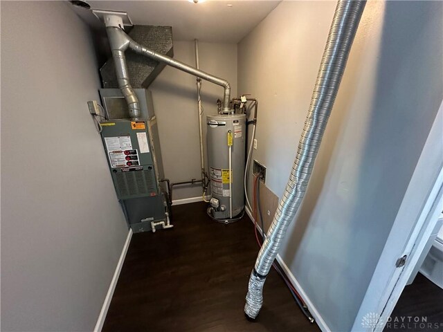 utility room with gas water heater