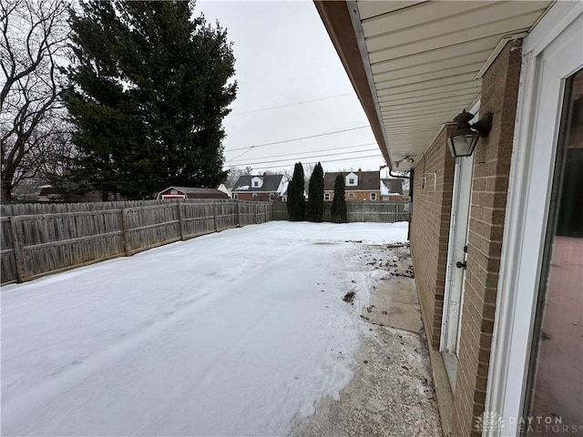 view of yard layered in snow