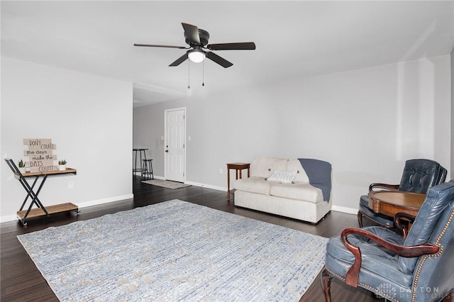 bedroom with dark hardwood / wood-style flooring and ceiling fan