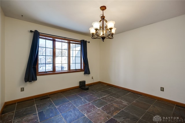 empty room with an inviting chandelier