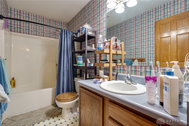 full bathroom with toilet, vanity, and shower / tub combo