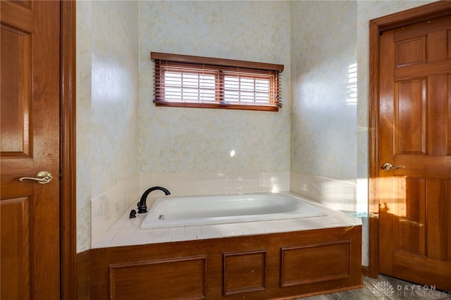 bathroom with a tub to relax in