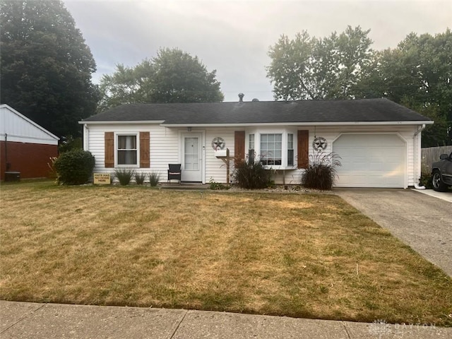 ranch-style home with a garage and a front lawn