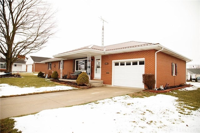 view of front of property featuring a garage and a yard