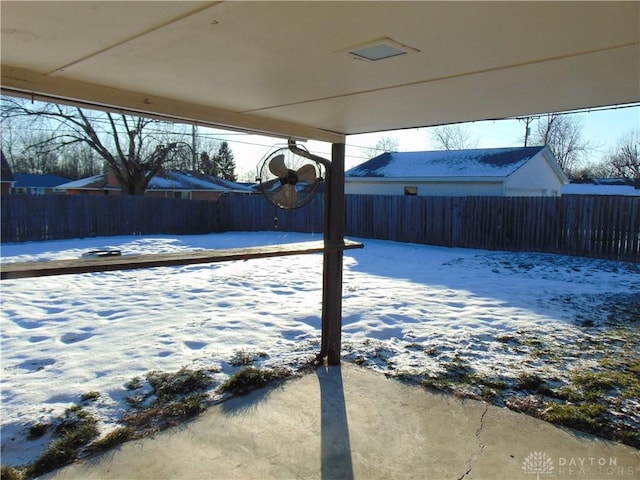 view of snow covered patio