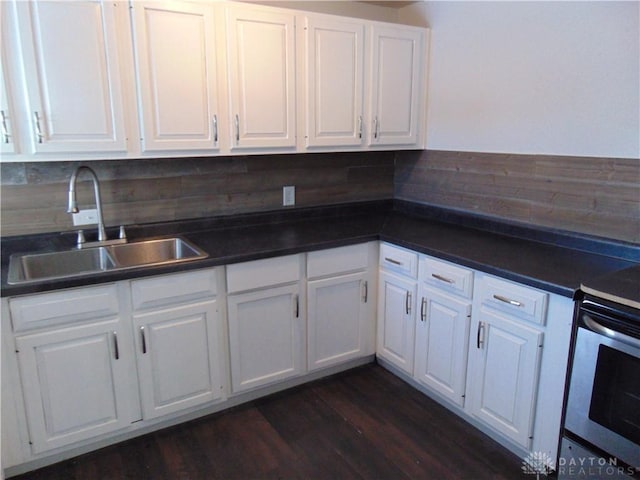 kitchen featuring white cabinets and sink