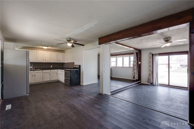 5254 Powell Rd, Dayton, OH 45424 - kitchen with stainless steel appliances, a ceiling fan, white cabinetry, beamed ceiling, and baseboards