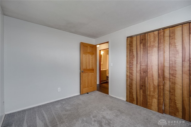 5254 Powell Rd, Dayton, OH 45424 - unfurnished bedroom featuring carpet floors, baseboards, and a closet