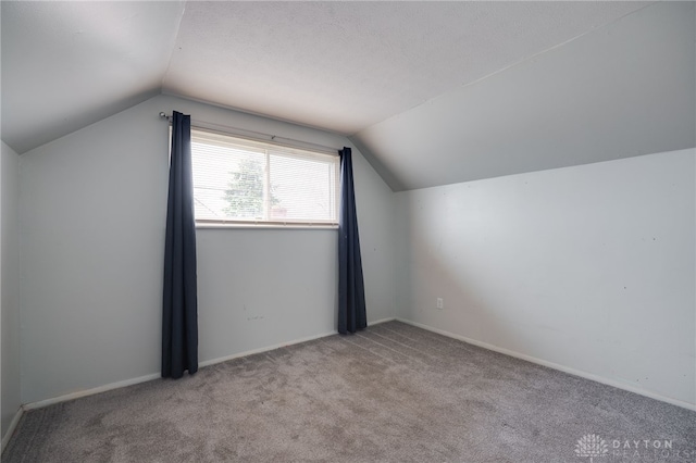 5254 Powell Rd, Dayton, OH 45424 - additional living space with lofted ceiling, carpet flooring, and baseboards