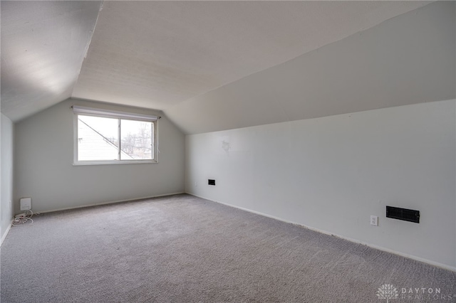 5254 Powell Rd, Dayton, OH 45424 - additional living space featuring vaulted ceiling, carpet floors, and baseboards