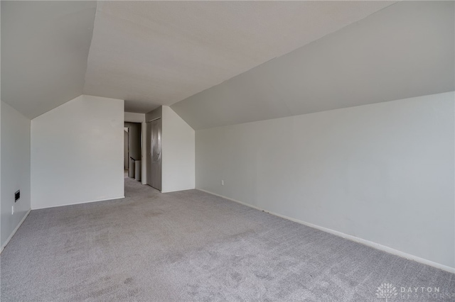 5254 Powell Rd, Dayton, OH 45424 - additional living space with light carpet, vaulted ceiling, and baseboards