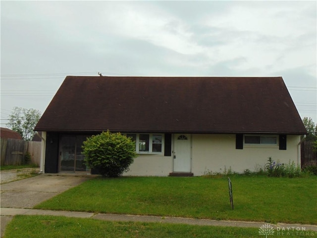 5254 Powell Rd, Dayton, OH 45424 - view of front of house featuring a front lawn, a shingled roof, and concrete driveway