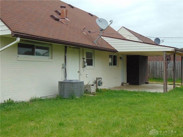 5254 Powell Rd, Dayton, OH 45424 - rear view of property with cooling unit, a patio area, and a shingled roof